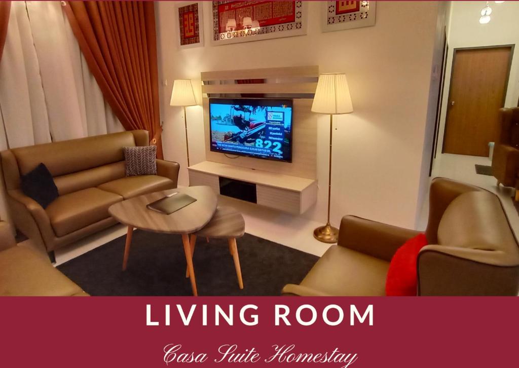 a living room with couches and a tv in a room at Casa Suite Homestay D'Imperio Professional Suite in Alor Setar