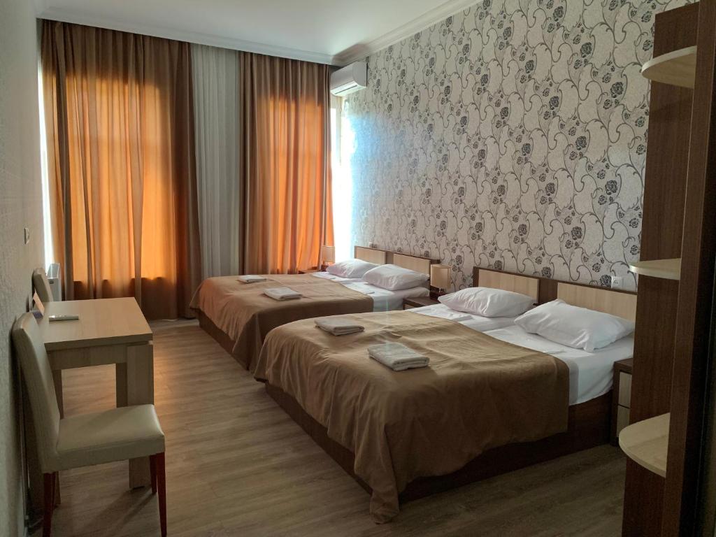 Postel nebo postele na pokoji v ubytování Hotel Red Bridge