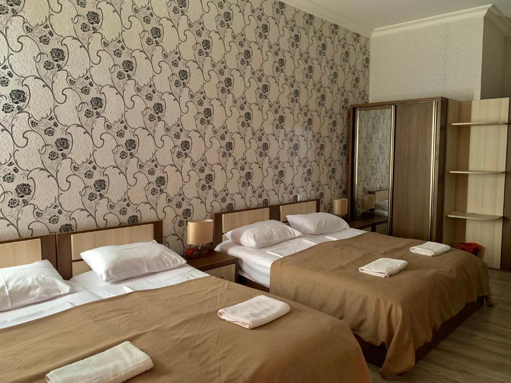 Postel nebo postele na pokoji v ubytování Hotel Red Bridge
