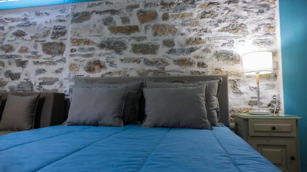 Postel nebo postele na pokoji v ubytování AFISSOS SEASIDE STUDIOS