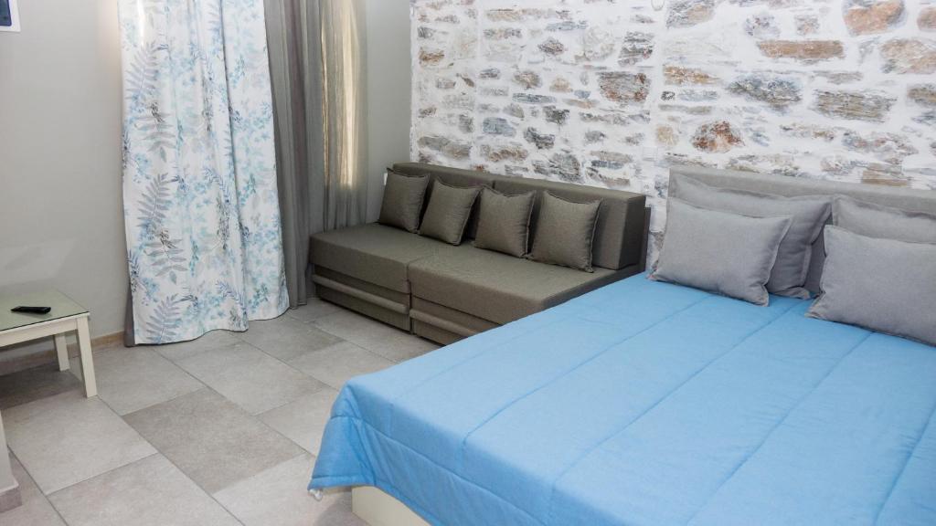 Postel nebo postele na pokoji v ubytování AFISSOS SEASIDE STUDIOS
