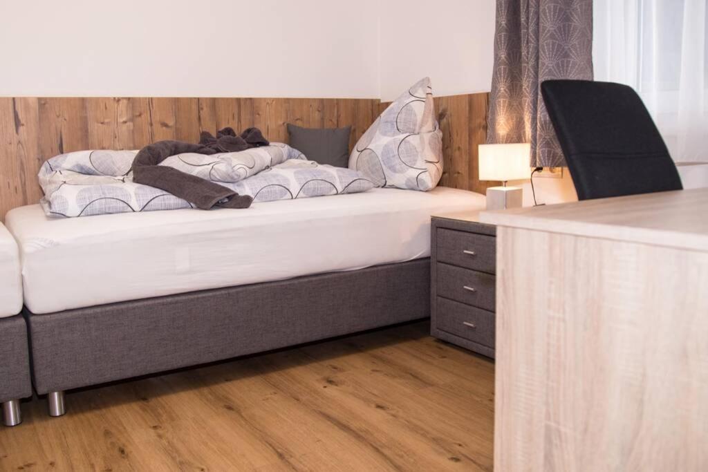Postel nebo postele na pokoji v ubytování ROCHUS APPARTEMENTS