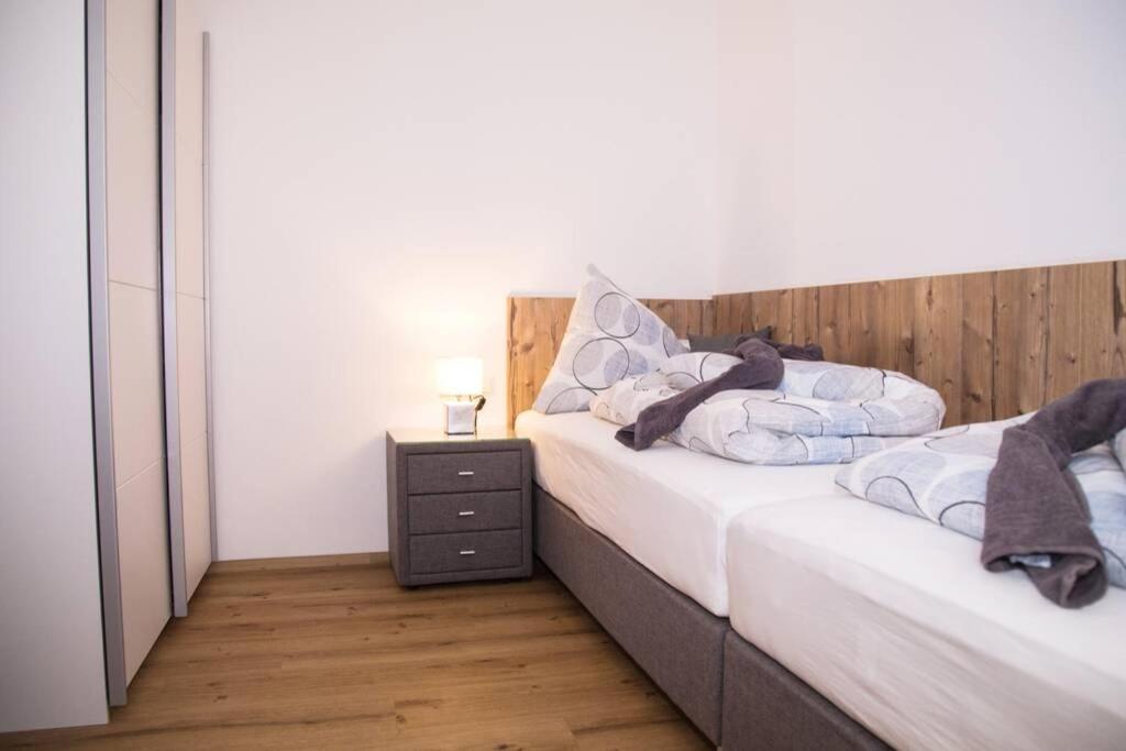 Postel nebo postele na pokoji v ubytování ROCHUS APPARTEMENTS
