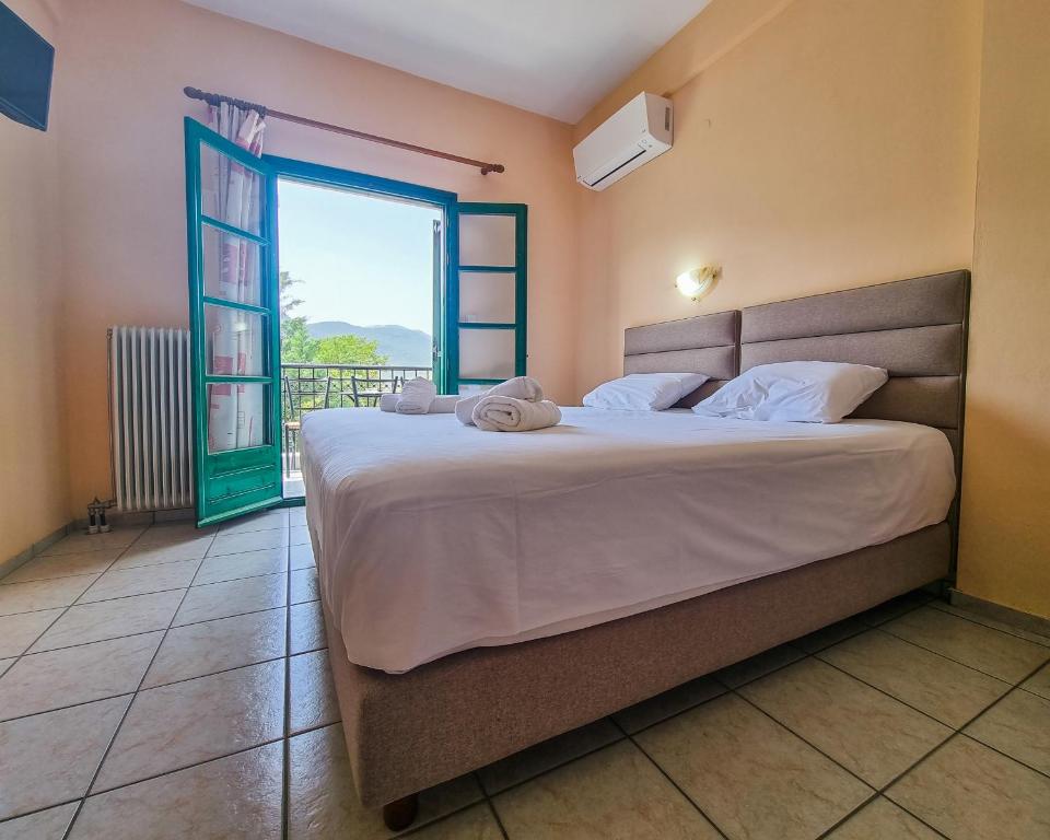 Postel nebo postele na pokoji v ubytování Hotel Spiridoula