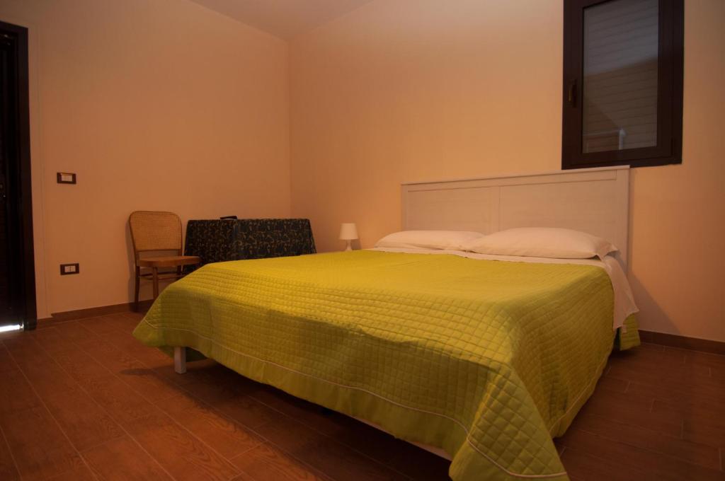 Postel nebo postele na pokoji v ubytování Albergo Conca D'Oro