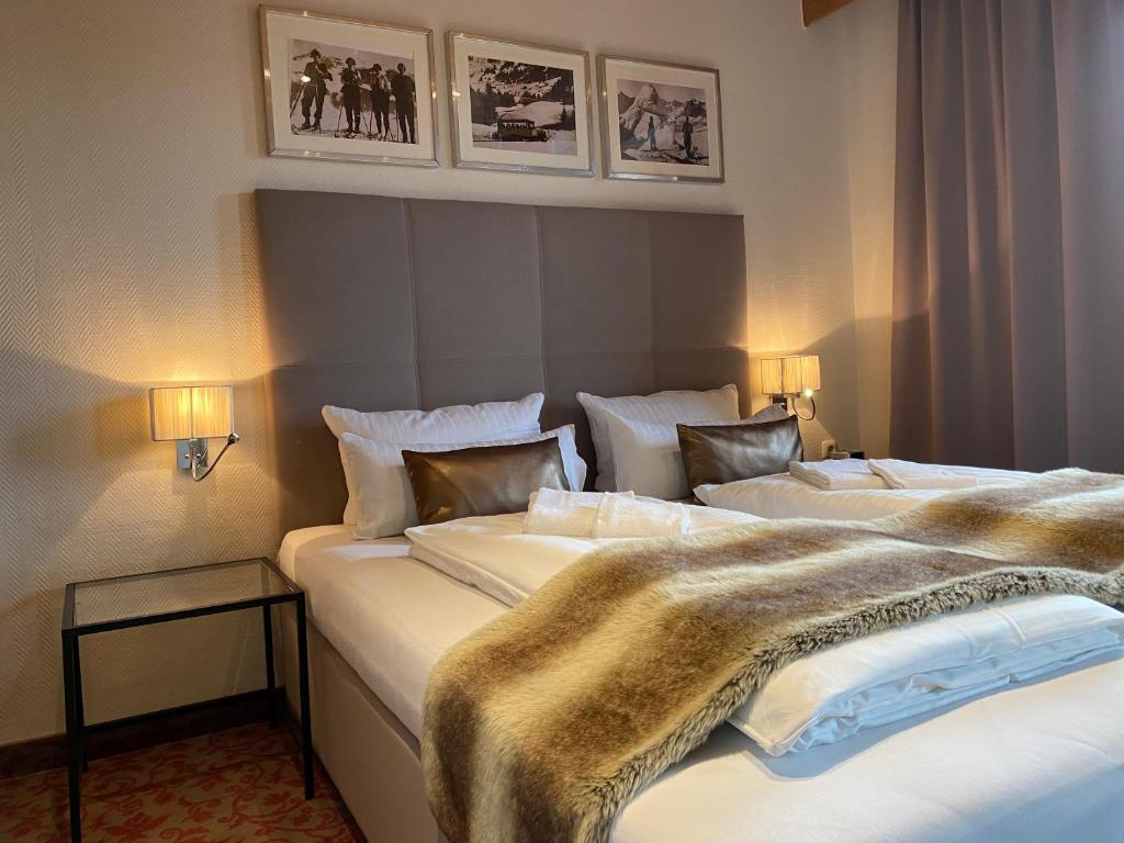 Postel nebo postele na pokoji v ubytování Hotel Strasser