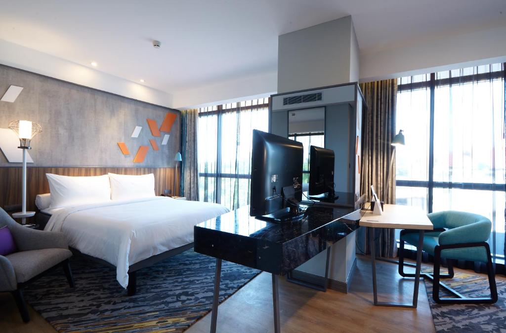 Postel nebo postele na pokoji v ubytování ibis Styles Medan Pattimura