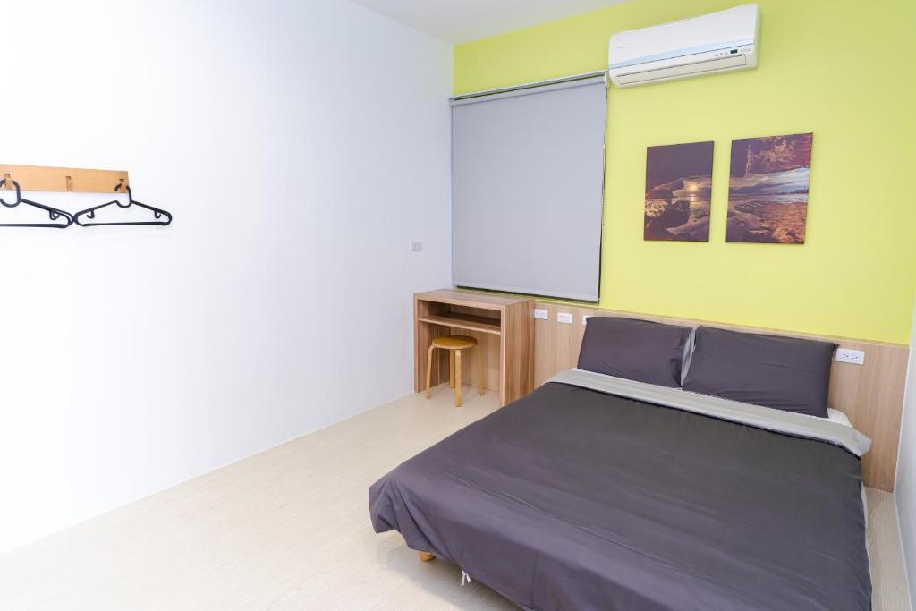Postel nebo postele na pokoji v ubytování Colorful B&B