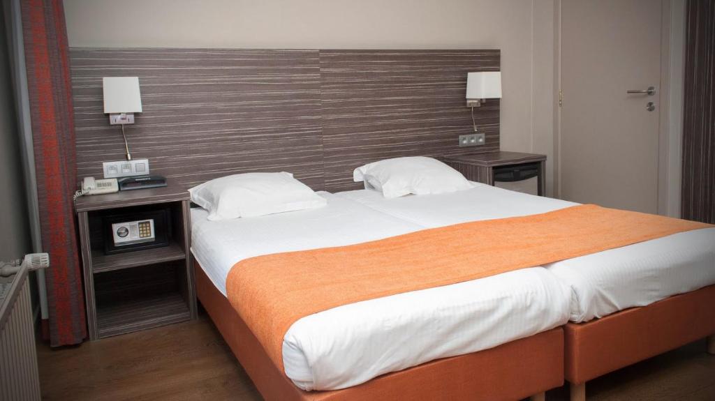 Postel nebo postele na pokoji v ubytování Hotel Castel
