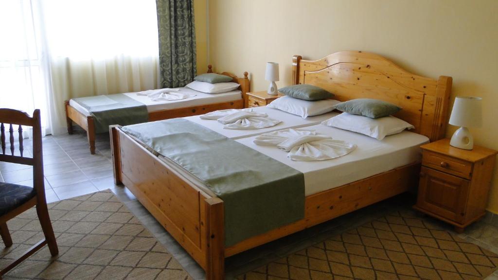 Postel nebo postele na pokoji v ubytování Stemak Hotel