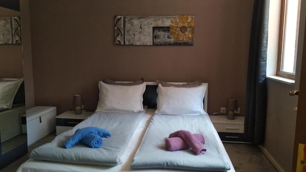 Ένα ή περισσότερα κρεβάτια σε δωμάτιο στο Snow Dreams 1 Grand Monastery