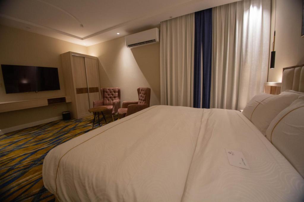 Postel nebo postele na pokoji v ubytování فندق قوبا السويس - Quba Swess Hotel Jazan