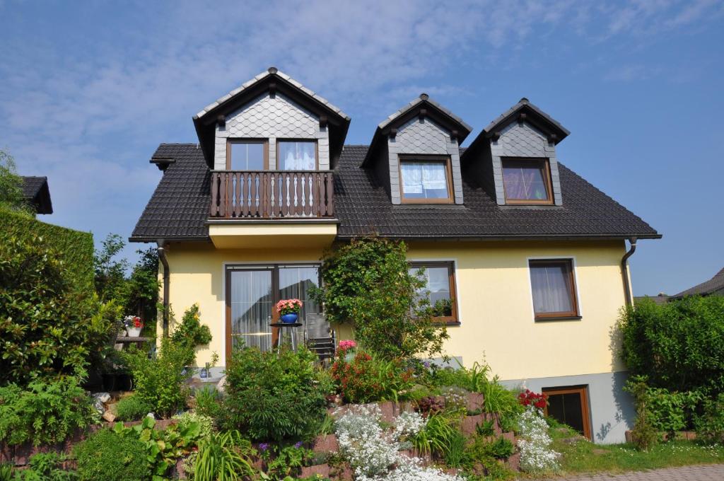 a yellow house with a black roof at ****Fewo "Alltag...ADE'" in Dippoldiswalde