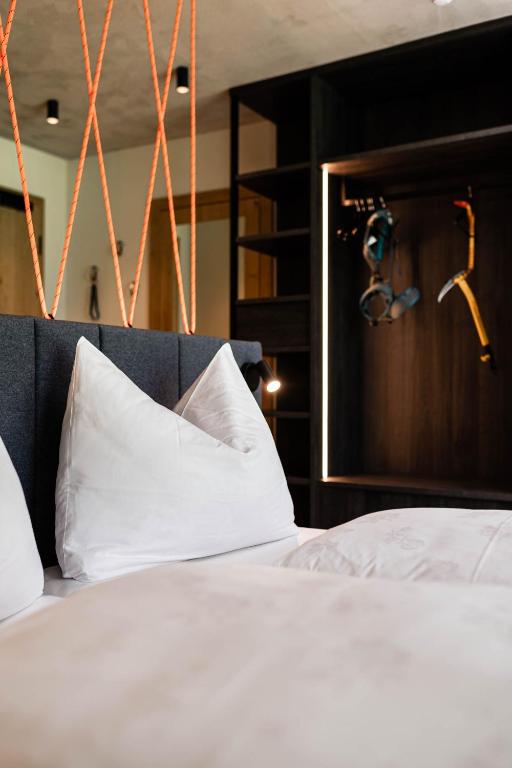 Postel nebo postele na pokoji v ubytování Hotel Wochtla Buam