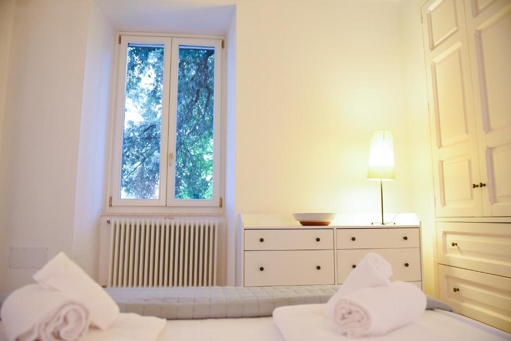 Łóżko lub łóżka w pokoju w obiekcie Villa Luciana