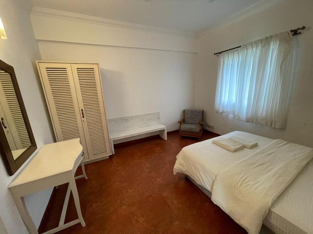Postel nebo postele na pokoji v ubytování Casa Legend Villa & Apartments Arpora - Baga - Goa