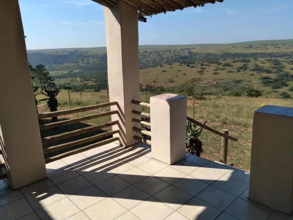 a view from the porch of a house with a fence at Non Stop Adventures in Pietermaritzburg