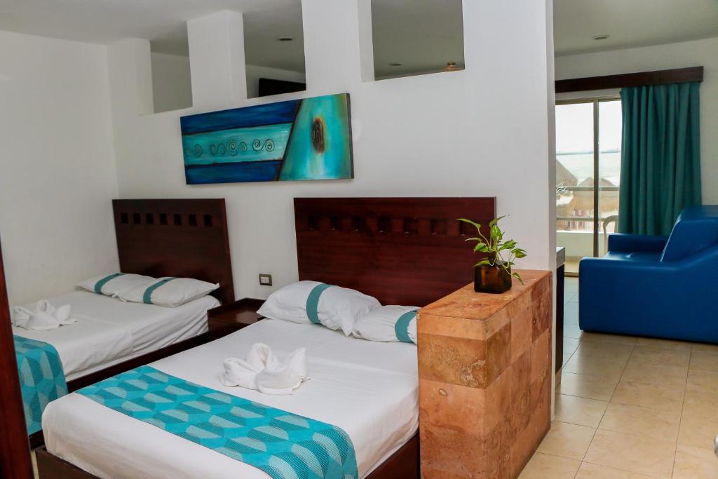 Postel nebo postele na pokoji v ubytování Playa Linda Hotel
