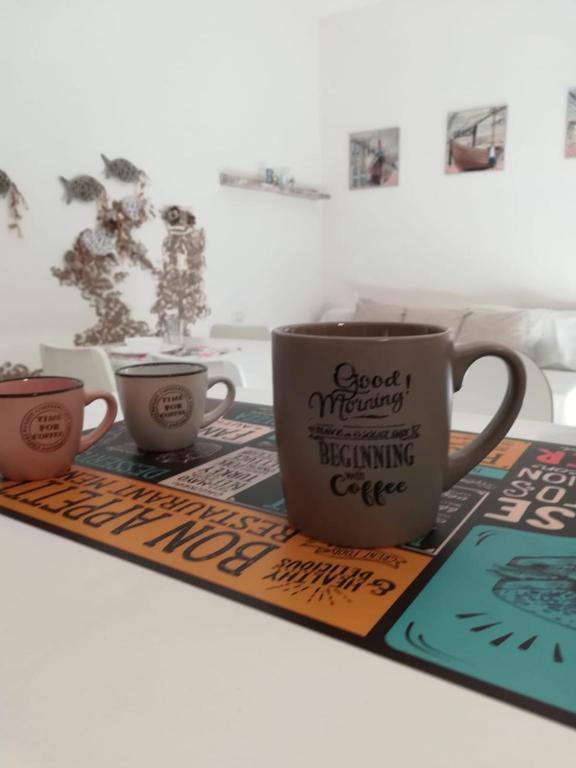Coffee and tea making facilities at APPARTAMENTO CORALLO with PRIVATE GARDEN