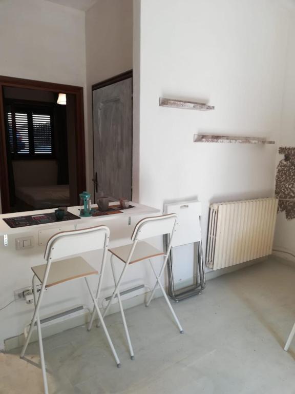 A seating area at APPARTAMENTO CORALLO with PRIVATE GARDEN