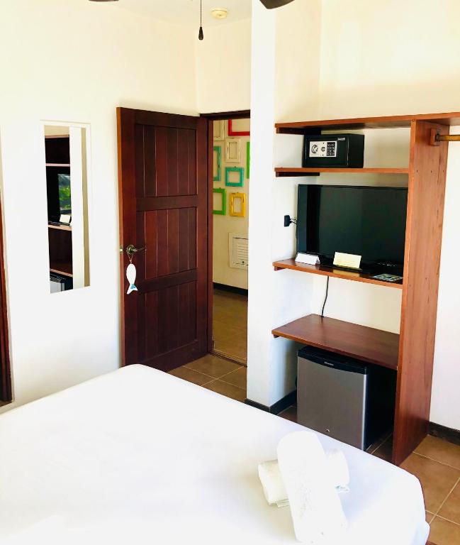 TV a/nebo společenská místnost v ubytování Hotel Boutique Pachamama
