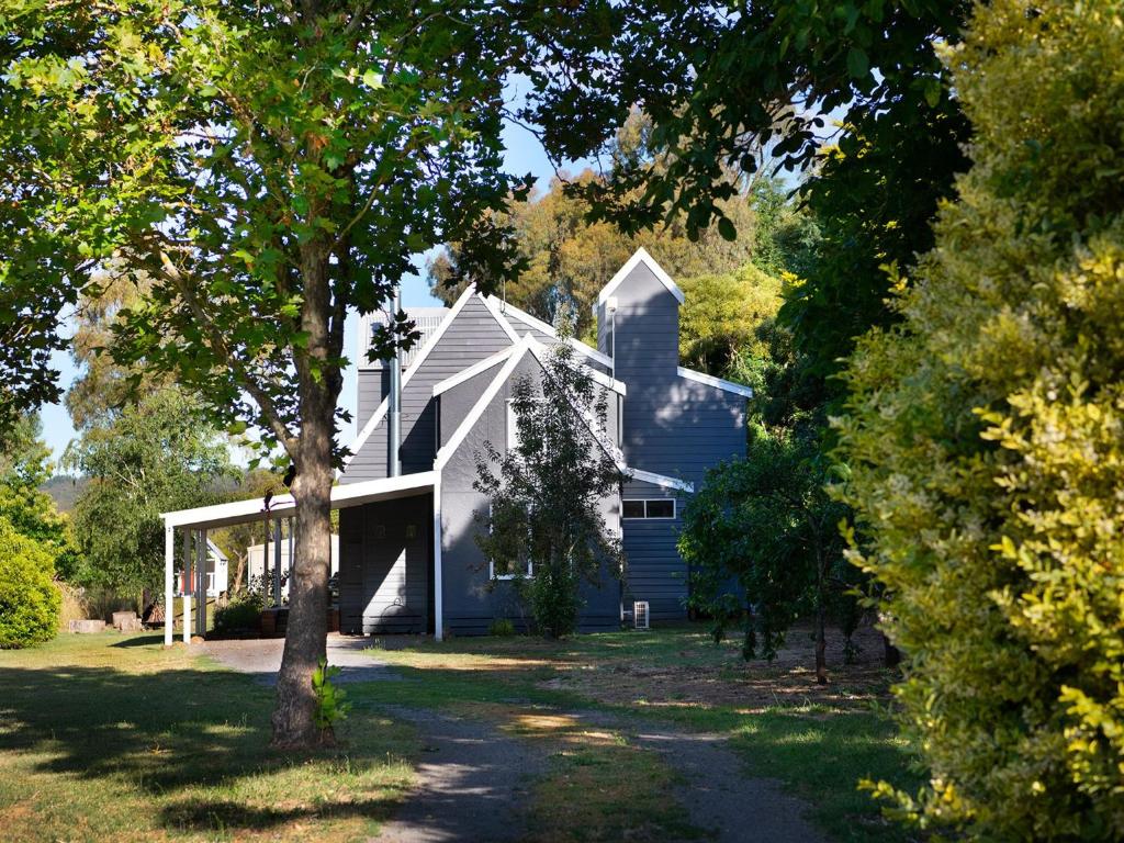 a white house with a tree in front of it at Morton House in Glenlyon