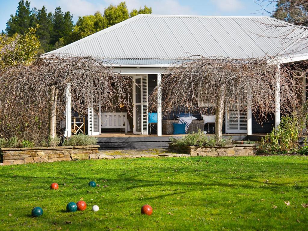 a house with easter eggs in the yard at Green Gully House in Glenlyon