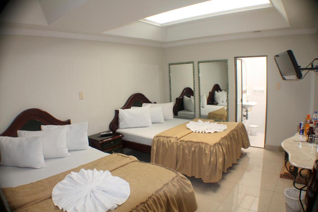 Postel nebo postele na pokoji v ubytování Hotel Business