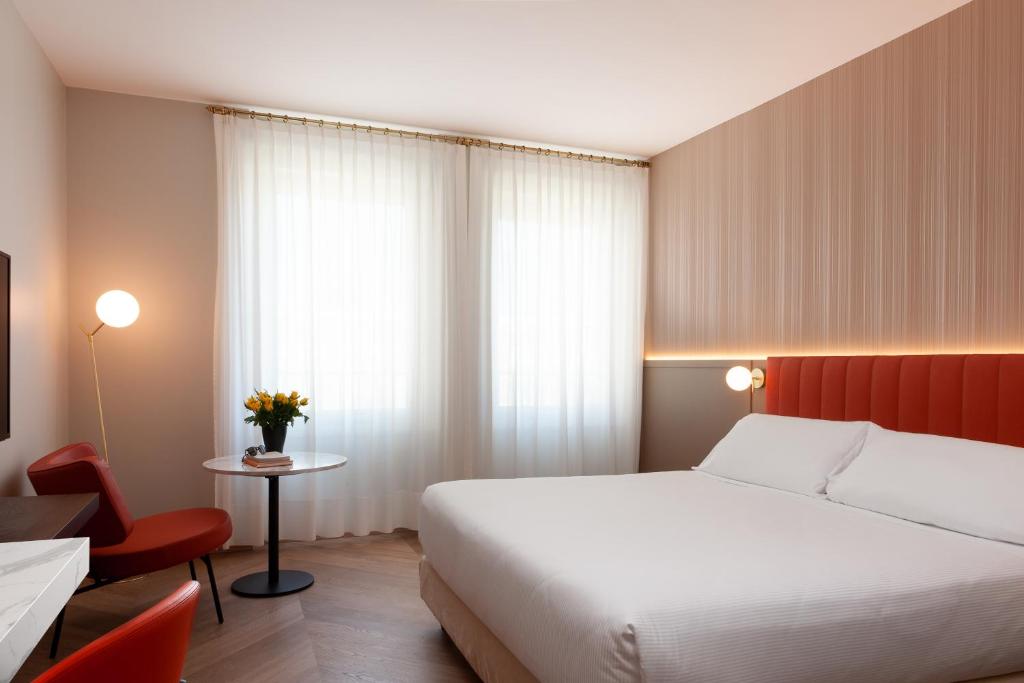 Postel nebo postele na pokoji v ubytování Agora' Palace Hotel