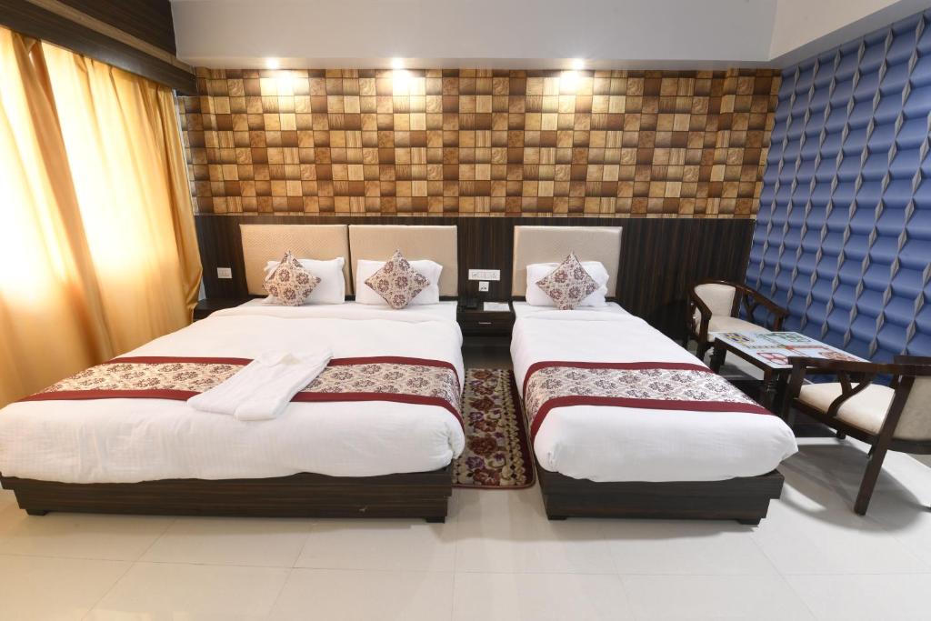 Voodi või voodid majutusasutuse Hotel Star Bodh Gaya toas