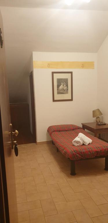 Postel nebo postele na pokoji v ubytování LH Albergo il Paradiso