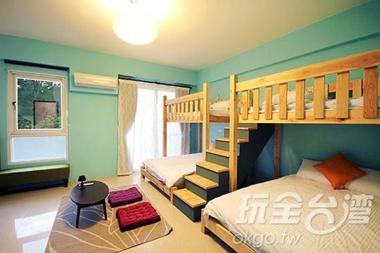 Postel nebo postele na pokoji v ubytování 艾兒民宿 l 包棟 l 按訂房人數開放房間8-21人