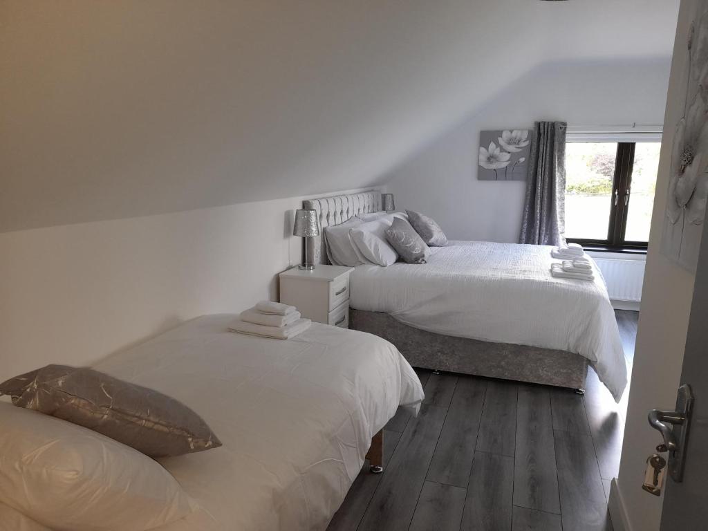 Postel nebo postele na pokoji v ubytování Glenbeg Lodge B&B