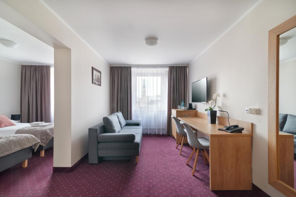 Ein Bett oder Betten in einem Zimmer der Unterkunft Hotel Renesans