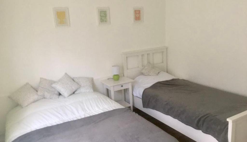 Ένα ή περισσότερα κρεβάτια σε δωμάτιο στο Le Courancon