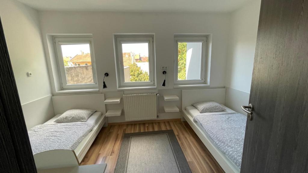 Posteľ alebo postele v izbe v ubytovaní Benevia Apartments