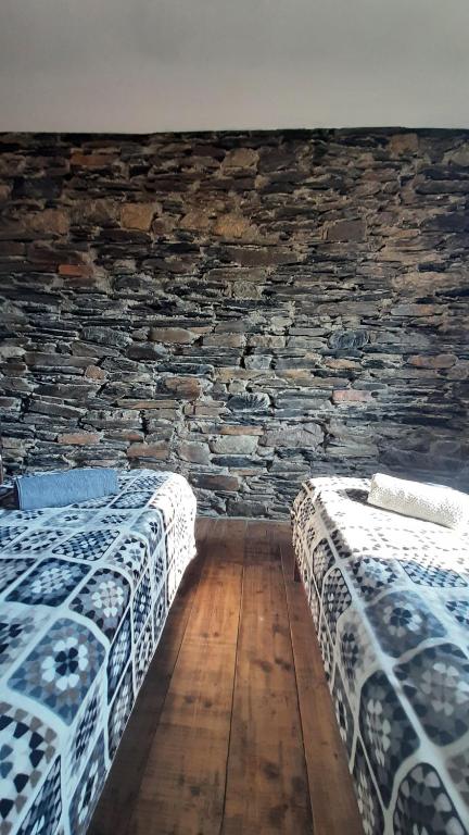 Postel nebo postele na pokoji v ubytování Guesthouse SVANURI SAKHLI