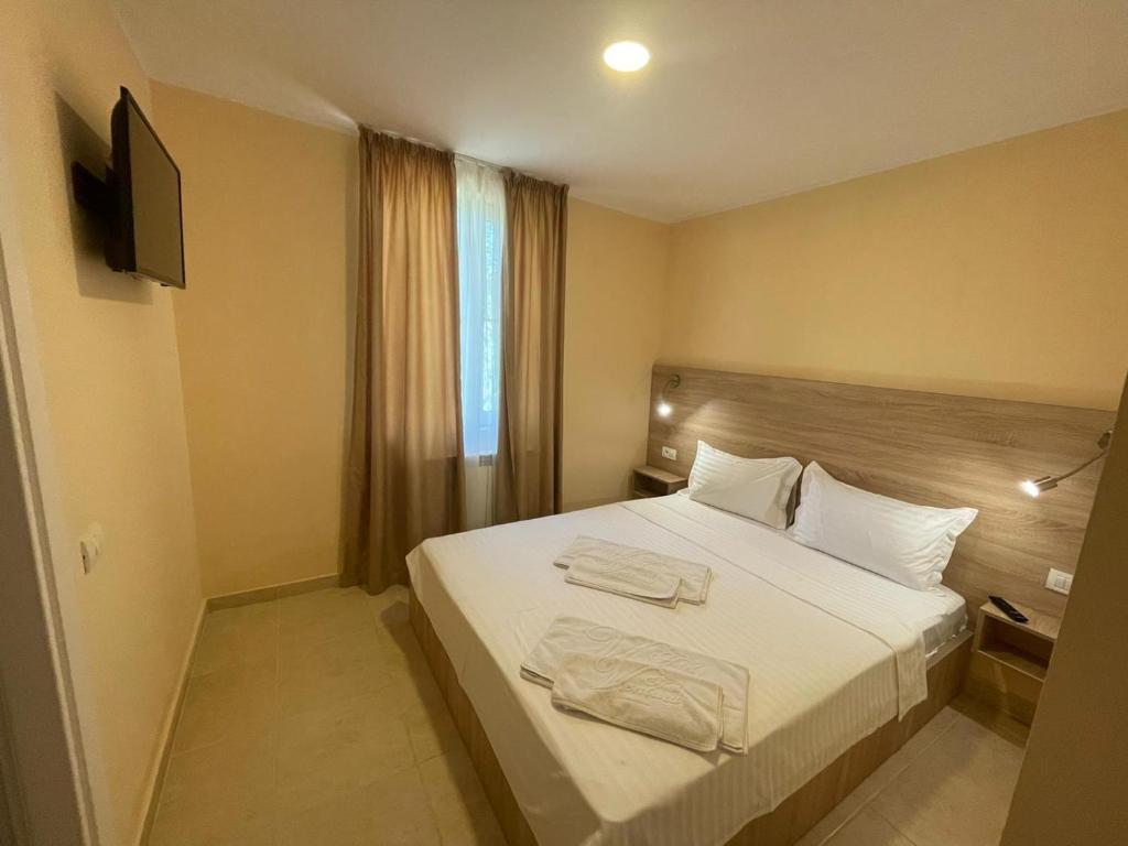 Postel nebo postele na pokoji v ubytování Hotel Olt by Ventura