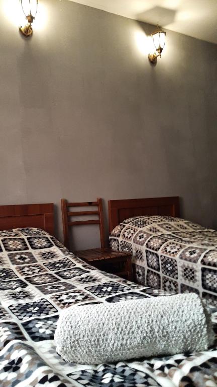 Postel nebo postele na pokoji v ubytování Guesthouse SVANURI SAKHLI