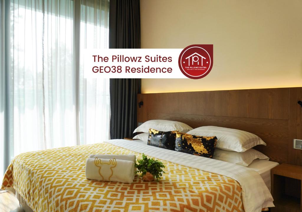 a hotel room with a bed with a sign on it at Geo38 Prime Suites Genting Highlands in Genting Highlands