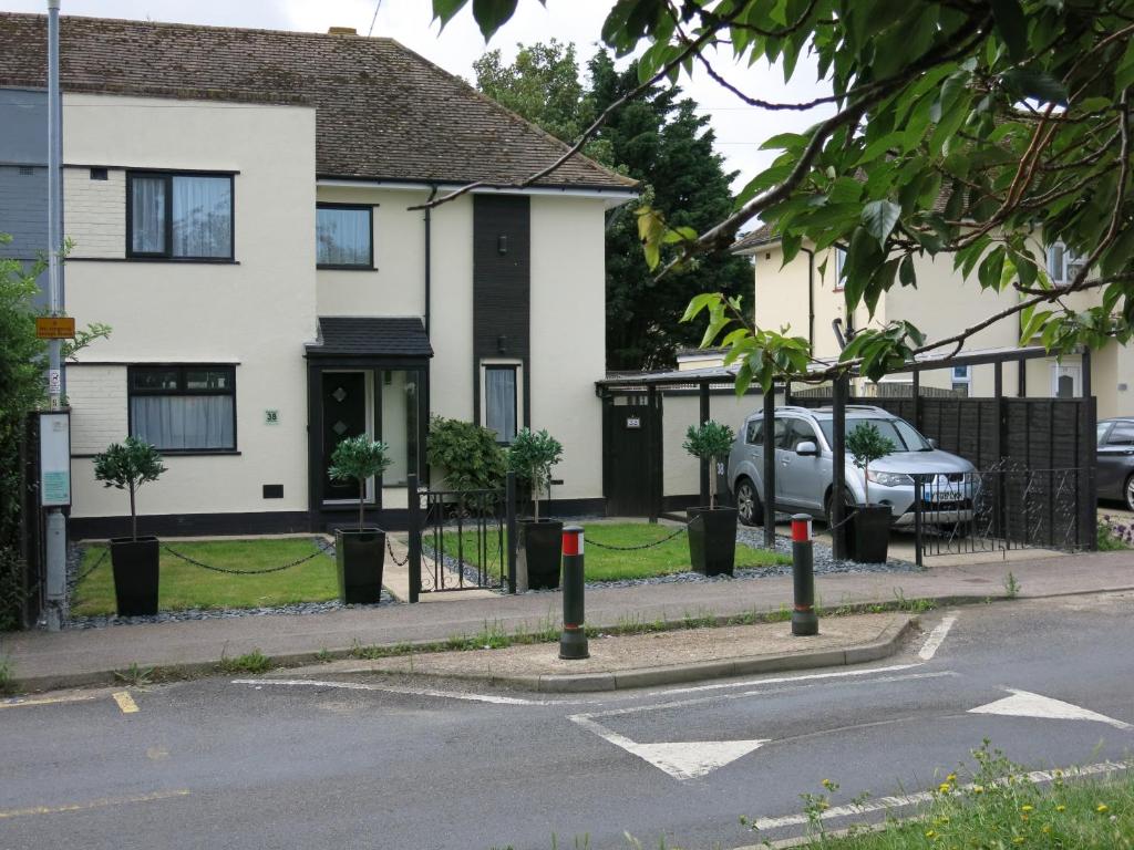 a house with a car parked in front of it at 3 Bedroom Home with Welcome Breakfast near Beaches in Ramsgate