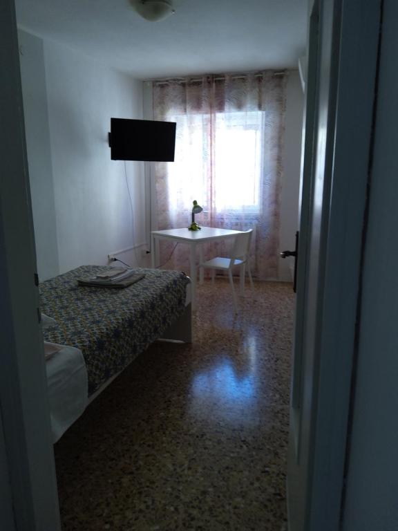 Postel nebo postele na pokoji v ubytování alloggio verona est S. Pietro