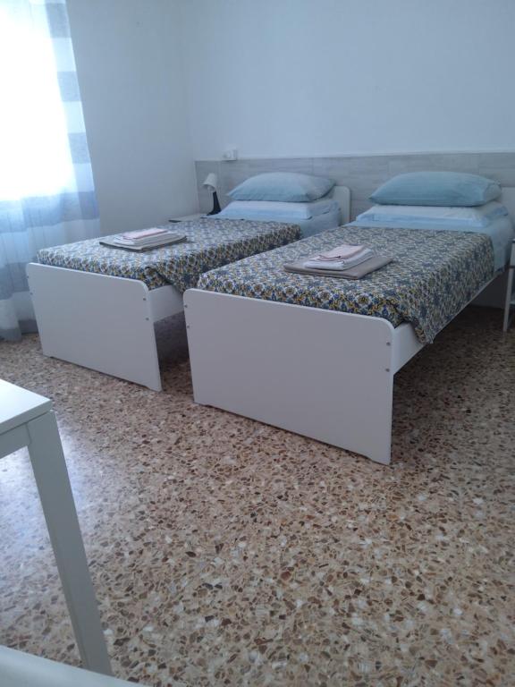 Postel nebo postele na pokoji v ubytování alloggio verona est S. Pietro