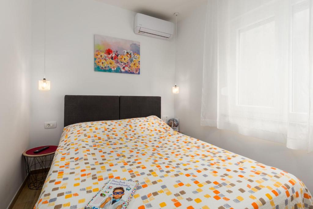 Postel nebo postele na pokoji v ubytování Sylvia Center Apartment