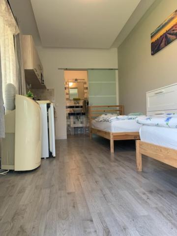 Posteľ alebo postele v izbe v ubytovaní Levendulakert Siófok Apartmanház