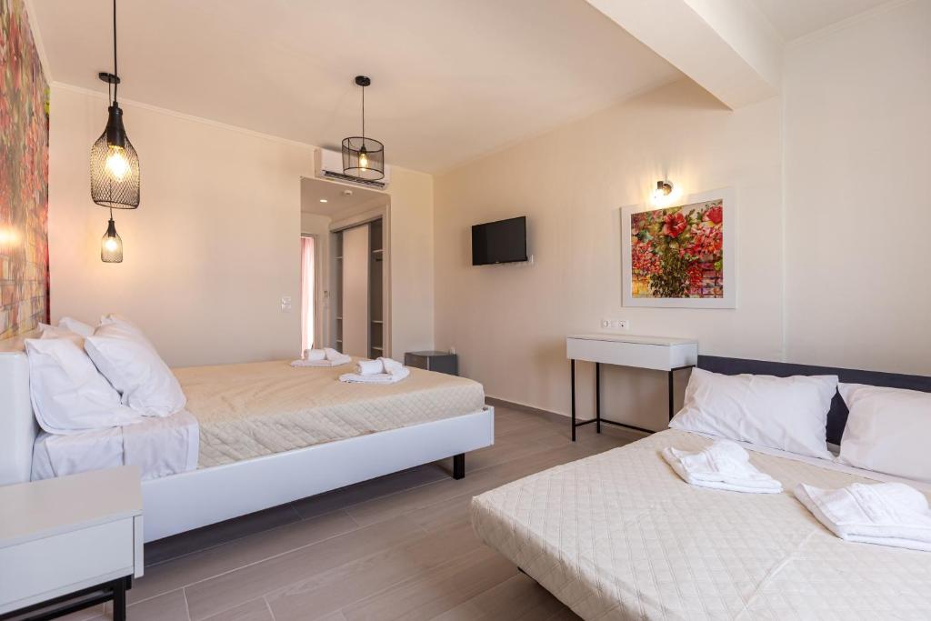 Postel nebo postele na pokoji v ubytování Aqua Luxury Suites by Estia