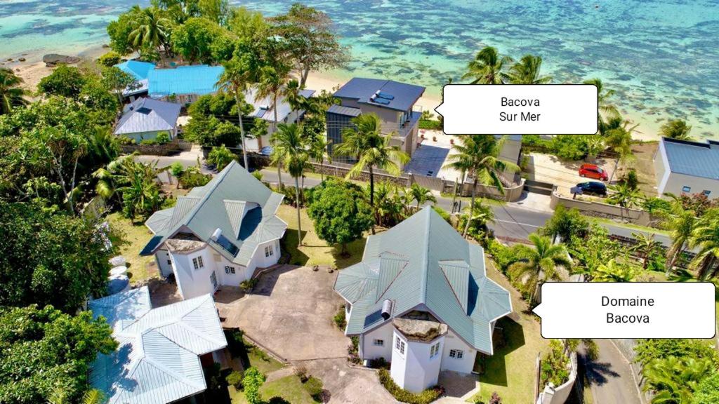 an aerial view of a house on a beach at Le Domaine de Bacova in Pointe Au Sel 