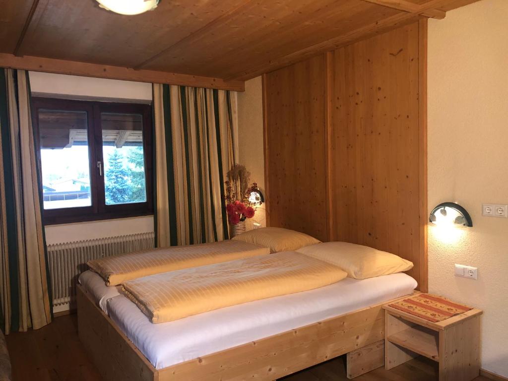 Postel nebo postele na pokoji v ubytování Ferienhof Kampfl