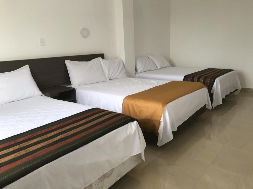 Postel nebo postele na pokoji v ubytování Mare S&M Casa Hostal