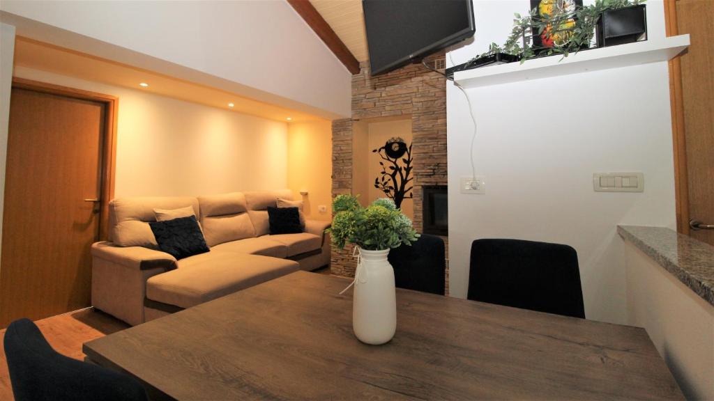 a living room with a table and a couch at Apartments Brcic in Tar